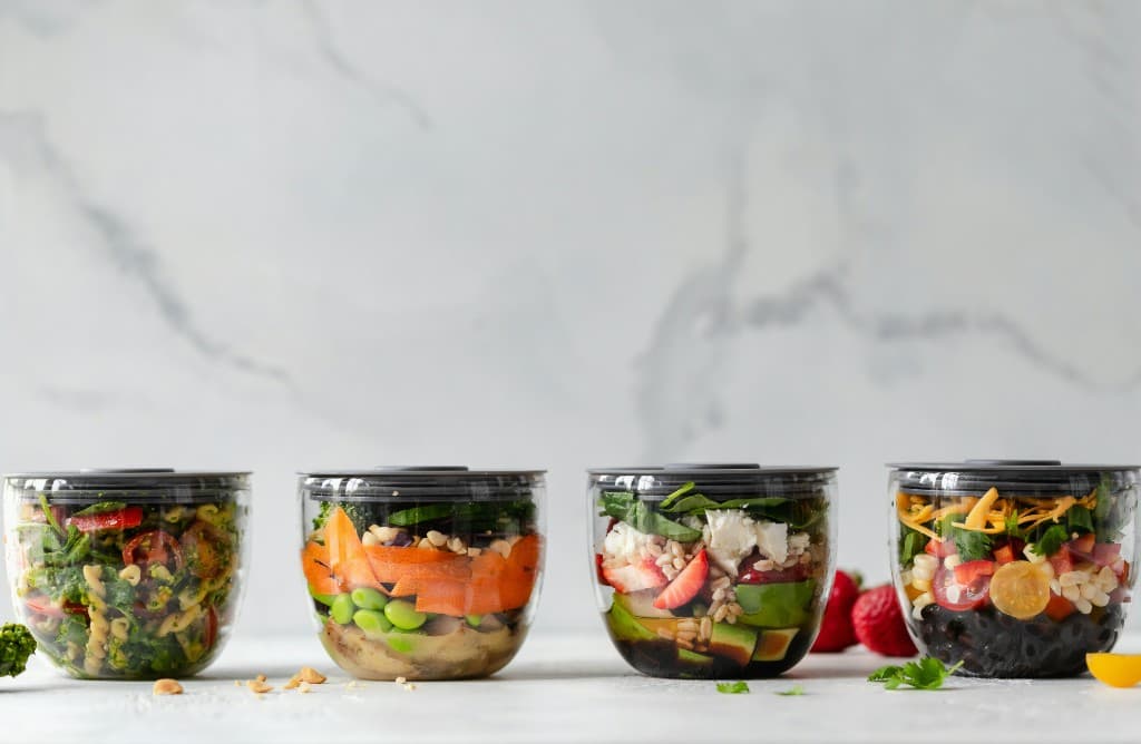 Fresh layered salads in clear meal prep containers